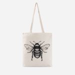 Natural cotton Manchester bee tote bag by The Sculpts with detailed black bee illustration on beige canvas