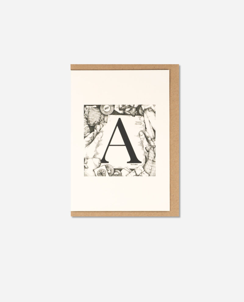 The Manchester Letters A for Affleck's Palace greeting card on cream background with kraft brown envelope behind