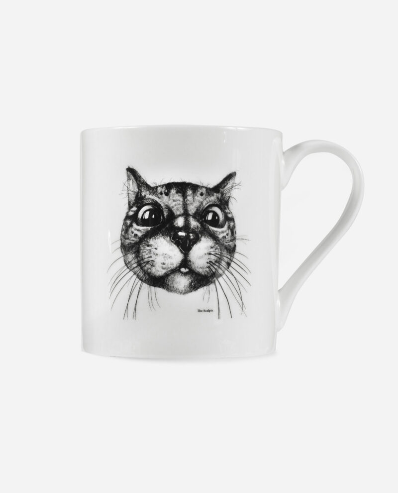 Cat mug in white bone china featuring expressive black ink drawing of cat with large eyes and whiskers