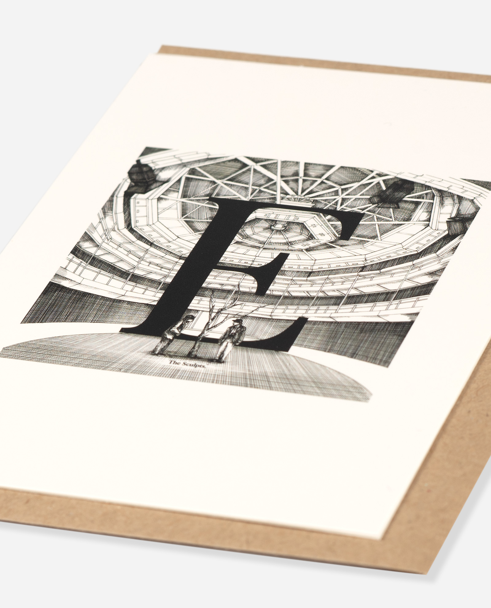 Angled view of Manchester Exchange Theatre card showing dimensional detail of black letter E over line-drawn theatre seating