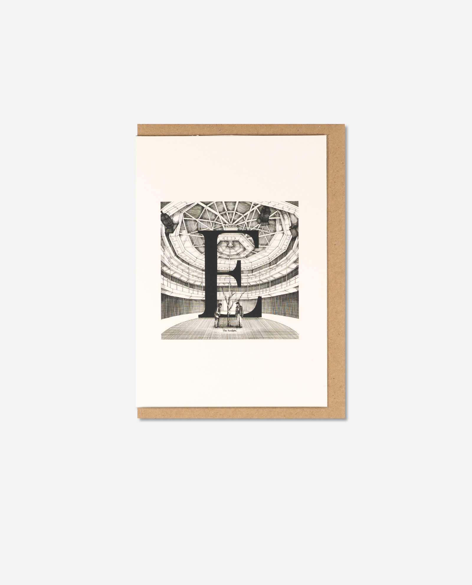 Flat lay of Exchange Theatre letter E greeting card on brown kraft envelope, cream card stock with architectural drawing