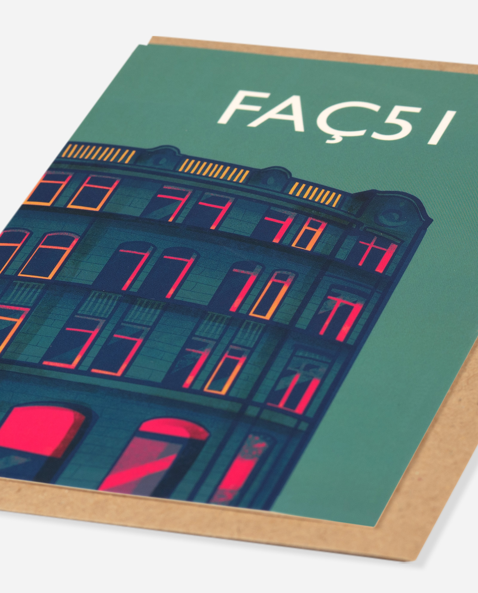 Faç51 greeting card shown at oblique angle, displaying detailed illustration of Hacienda building with yellow striped roofline detail