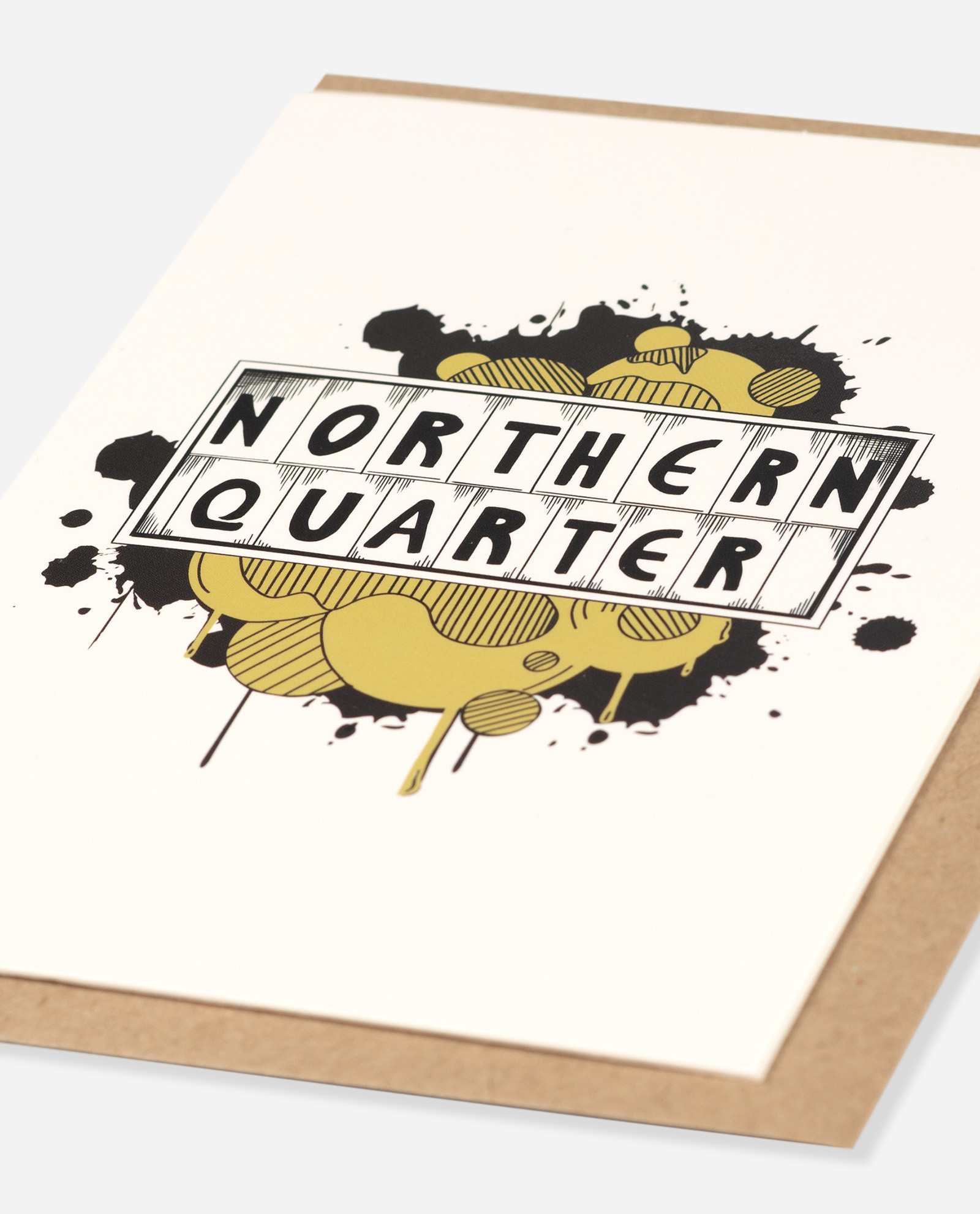 Angled view of Northern Quarter Greeting Card showing detailed hatching and line work on yellow paint effect with brown envelope edge