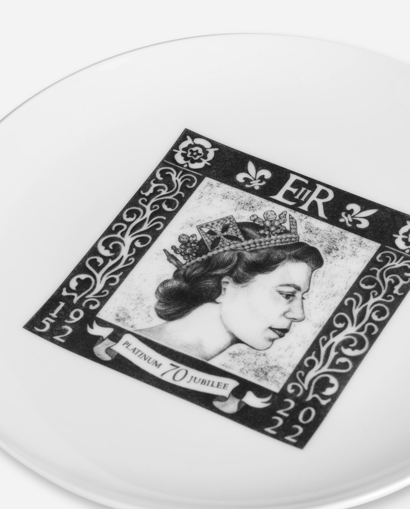 Close-up oblique view of Platinum Jubilee Plate showing detailed stamp artwork and bone china surface texture