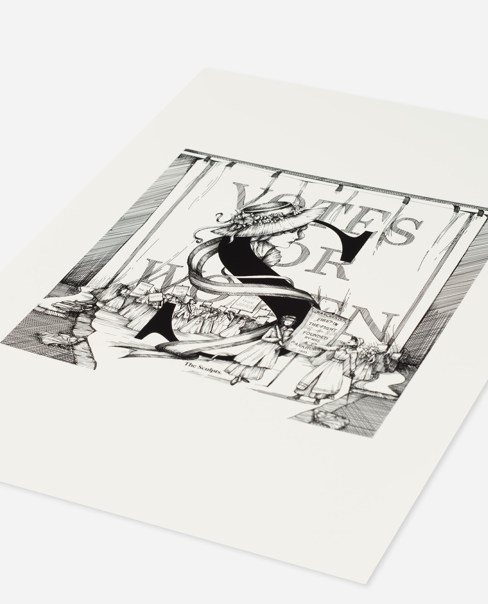 Angled view of Manchester suffragettes art print on white paper stock showing detailed cross-hatched illustration style