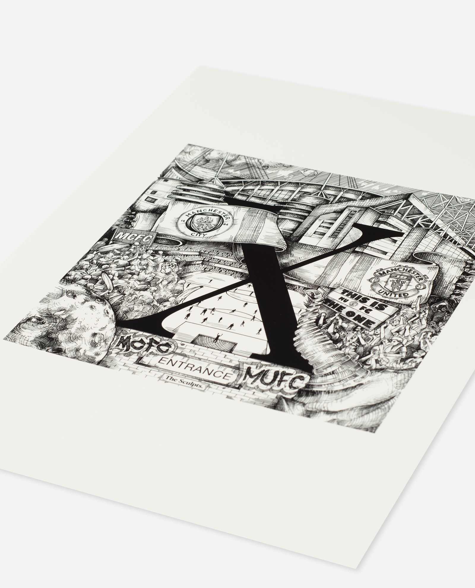 Angled view of Manchester Letter X print by The Sculpts on cream paper showing detailed football stadium illustrations beneath bold black letter