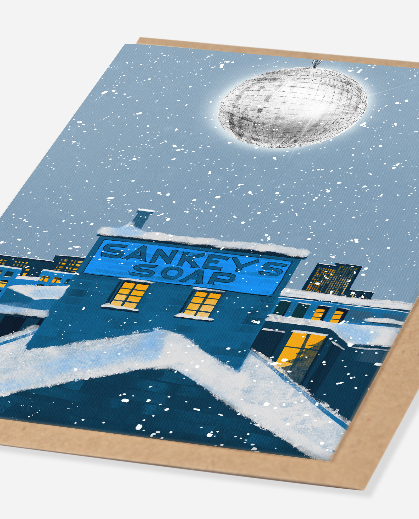 Close-up angle of Sankey's Soap Christmas card showing snow detail and disco ball illustration by The Sculpts