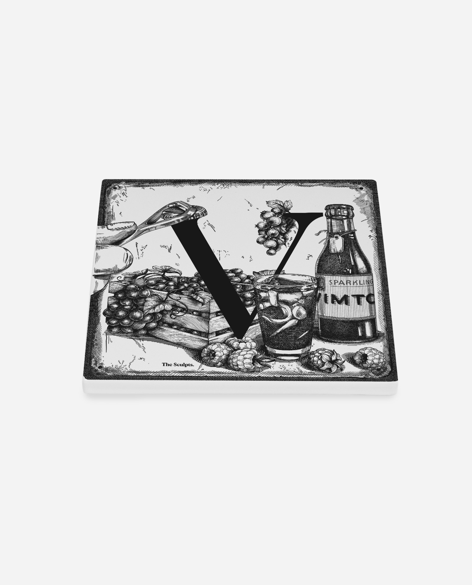 The Sculpts Manchester Vimto ceramic tile shown at an angle displaying surface detail and black letter V with fruit illustrations