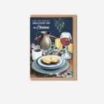 Manchester Tart Christmas greeting card by The Sculpts with navy background, festive table setting showing wine, coffee, candles and Manchester Tart slice