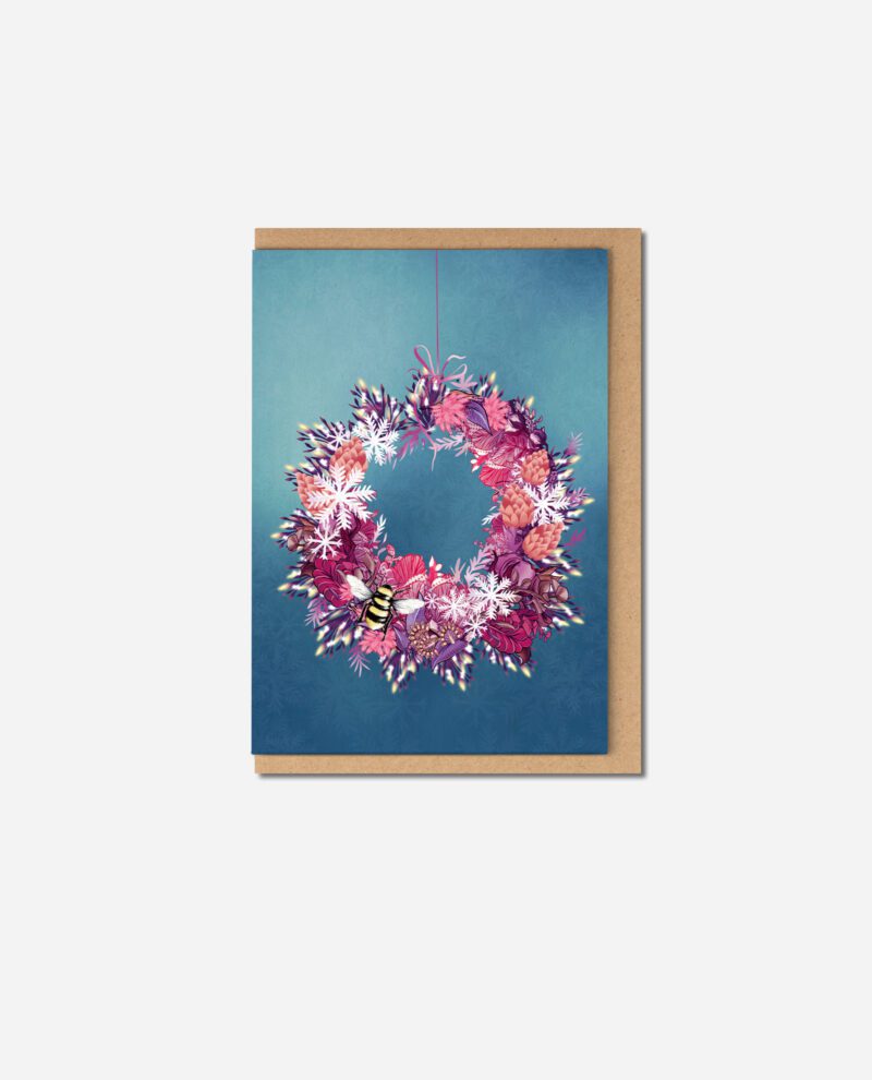 Christmas Wreath Two greeting card by The Sculpts showing circular wreath with pink ribbon, purple foliage, coral pinecones and bee on blue card with brown envelope