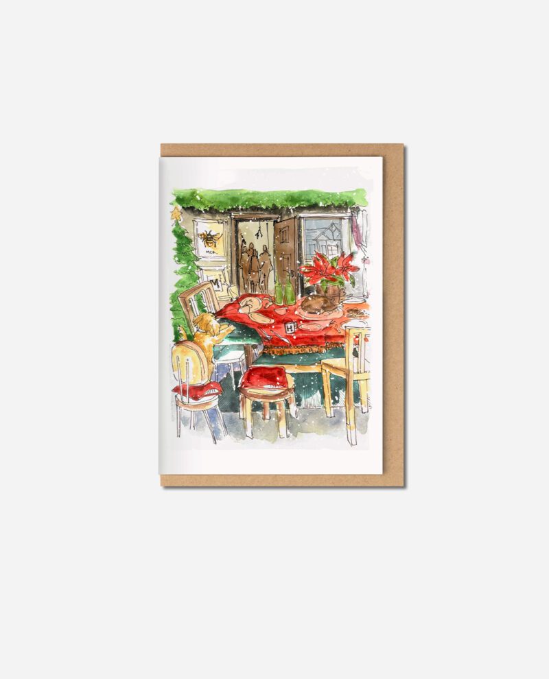 Hand-illustrated card showing cockapoo resting on red tablecloth at Christmas dinner table with chairs, hanging greenery and bee artwork
