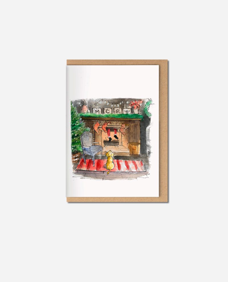 Christmas greeting card showing cockapoo on red and white striped rug watching fireplace with MERRY letters, stockings and festive greenery