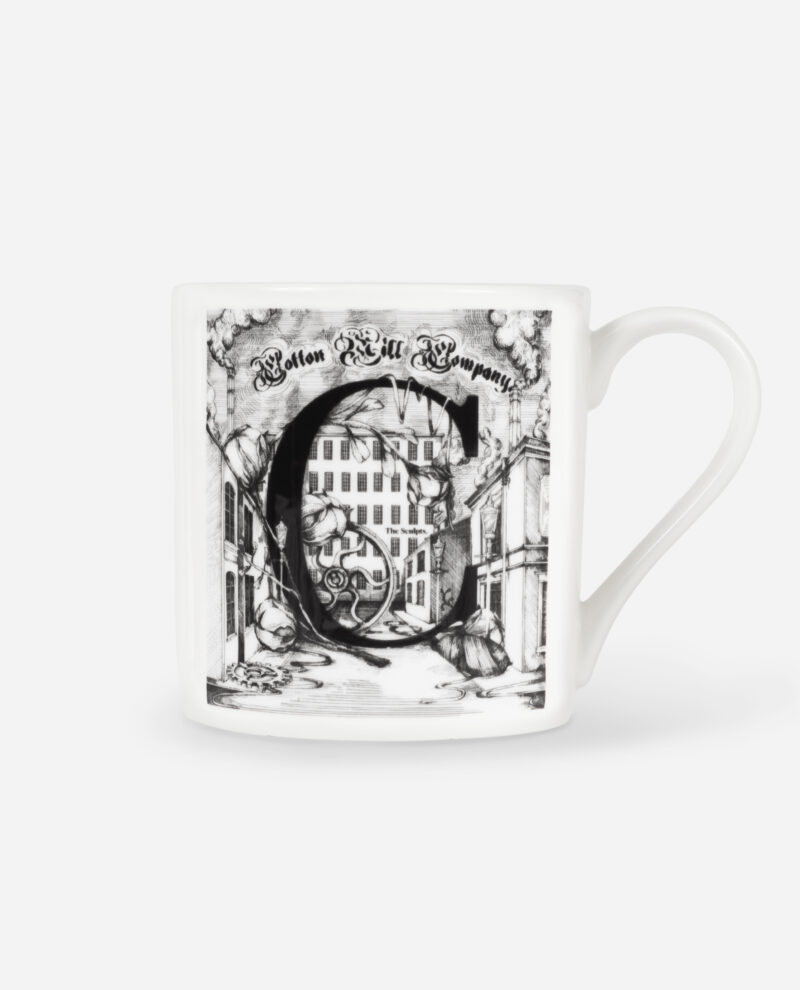 Front view of Manchester Letter C for Cotton Mug showing detailed black engraving of letter C with Victorian mill buildings on white bone china