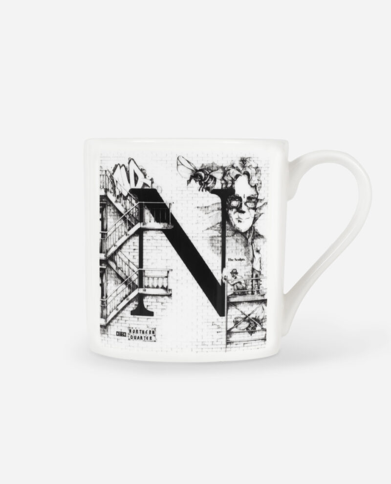 Front view of white Northern Quarter mug with black letter N design featuring Tony Wilson portrait and Manchester architecture by The Sculpts