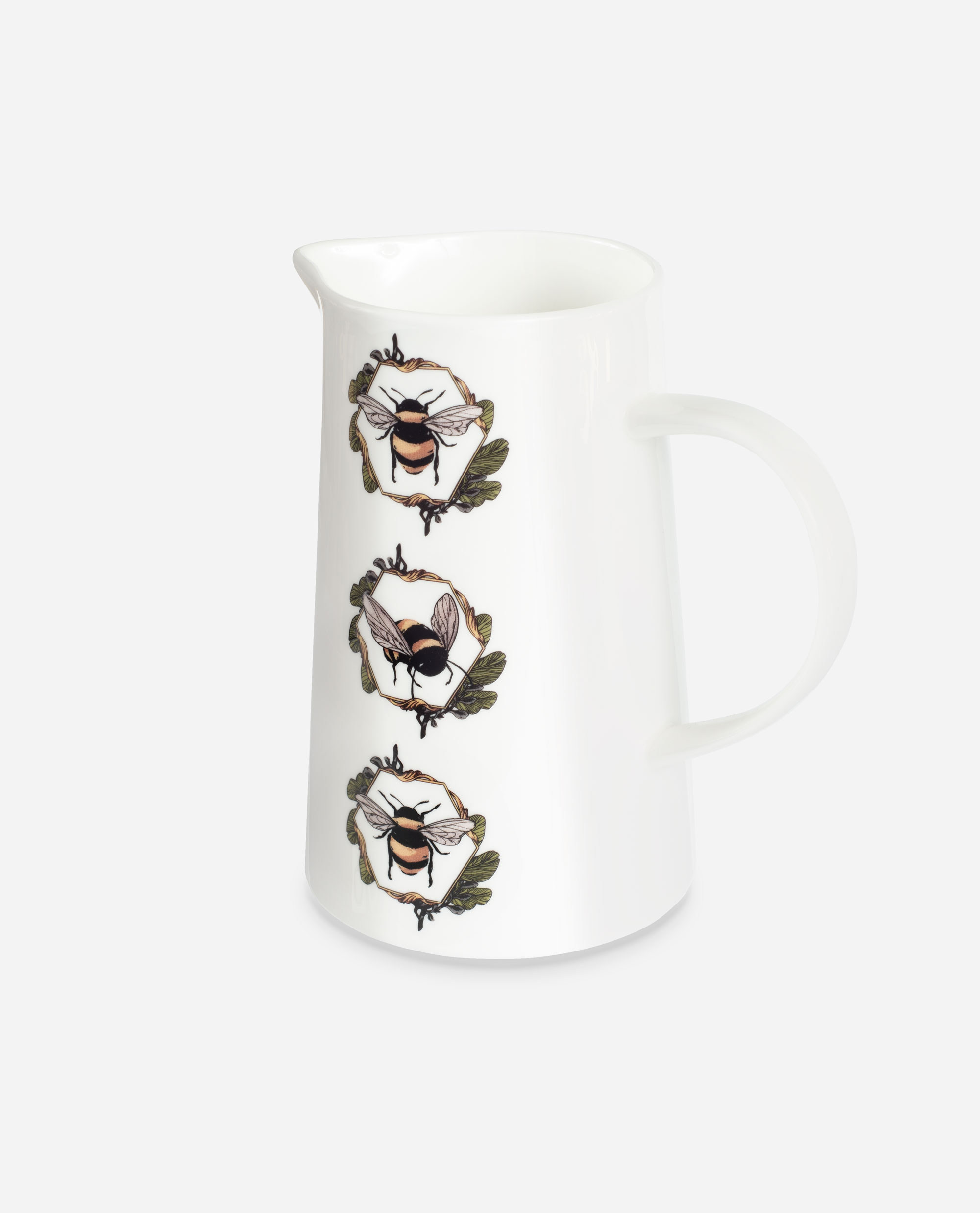 White bone china Honeycomb Bee Jug by The Sculpts shown at an angle, featuring three bumblebees in circular honeycomb wreaths with oak leaves