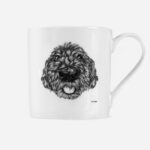 Cockapoo dog mug front view showing detailed black and white hand illustrated cockapoo portrait on white bone china