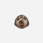 Fawn cockapoo pin badge showing tan curly fur, black nose, and red tongue on white background by The Sculpts