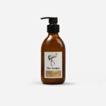 Amber glass pump bottle of Citrus Vulgaris hand lotion with black pump dispenser and cream label by The Sculpts