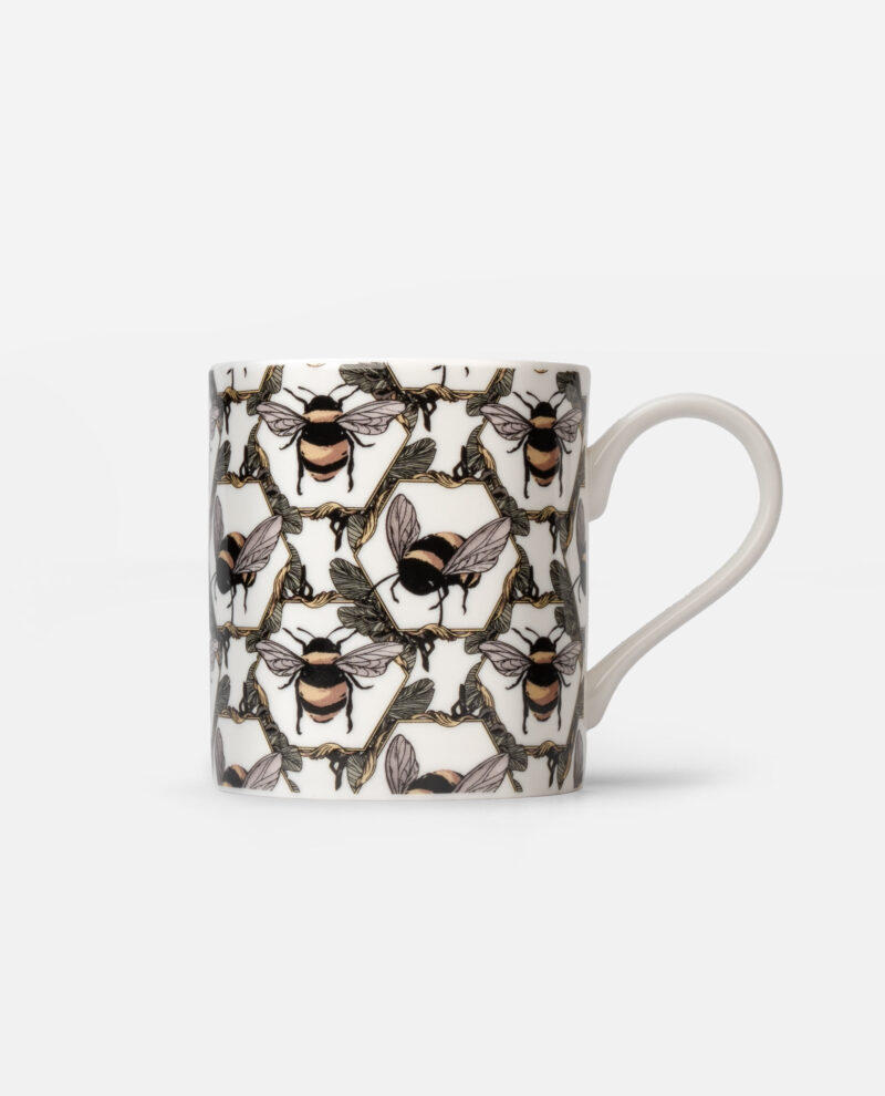 Honeycomb Bee Mug front view showing bumblebees with peach stripes and grey foliage pattern on white cylindrical mug