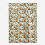 Citrus Vulgaris botanical tea towel flat lay showing repeating orange fruit with green foliage pattern on white cotton background