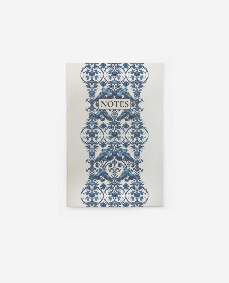 Flight of Feathers notebook front cover with blue ornate feather motif and 'NOTES' label on cream background