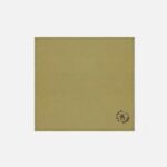 Soft olive green cotton bee napkin with embroidered Honeycomb Bee motif in the corner from The Sculpts