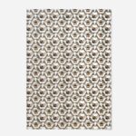 Honeycomb Bee tea towel by The Sculpts displaying full repeating pattern with twin bees, green foliage, and golden honeycomb geometry on cream cotton